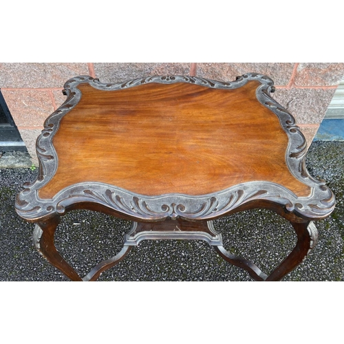 120 - AN ANTIQUE CARVED WALNUT OCCASSIONAL TABLE, with shaped top, carved perimeter, with carved cabriole ... 