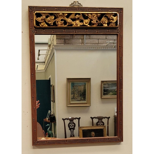 121 - A CARVED GILT WALL MIRROR WITH FLORAL DECORATION, 78 x 54cm