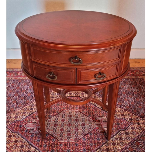 123 - A SMALL OVAL SHAPED THREE DRAWER TABLE / LAMP TABLE, contemporary piece in very good condition, some... 