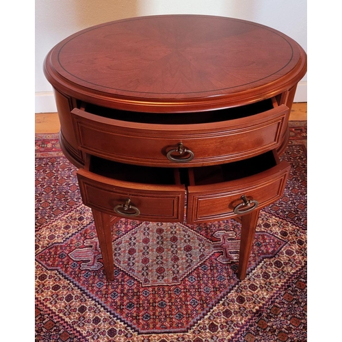 123 - A SMALL OVAL SHAPED THREE DRAWER TABLE / LAMP TABLE, contemporary piece in very good condition, some... 