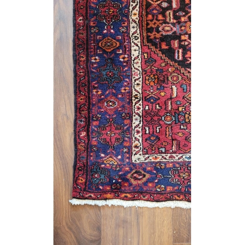 128 - A VERY GOOD QUALITY PERSIAN FLOOR RUG, with central medallion surrounded by geometric patterns with ... 