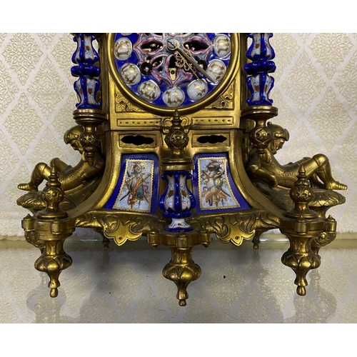 13 - A NAPOLEON III STYLE GILT BRONZE CLOCK, with polychrome porcelain plates surrounded by gilt frame wi... 