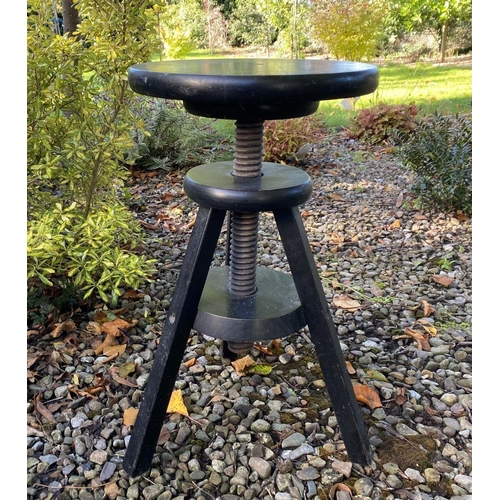 132 - A VINTAGE REVOLVING ‘CORKSCREW’ STOOL, in black with splayed tripod legs. Dimensions: 54cm high x 36... 