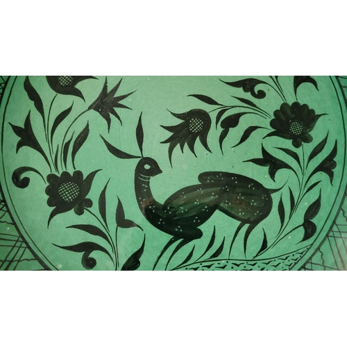 137 - A CONTEMPRARY HANDPAINTED & GLAZED DISPLAY PLATE, with silhouette design of a rabbit & foliage, sign... 