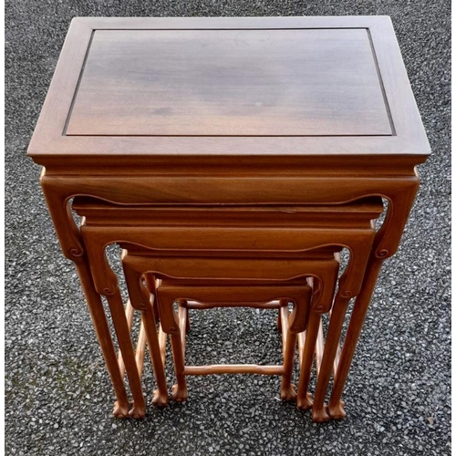 142 - A GOOD QUALITY NEST OF FOUR TABLES, with shaped scrolling detail to the skirt and upper leg, termina... 