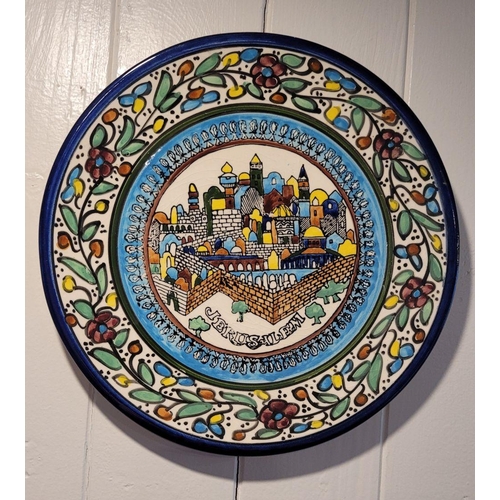 145 - A COLLECTION OF DECORATIVE WALL PLATES FROM AROUND THE WORLD, includes pieces from Jerusalem, Americ... 