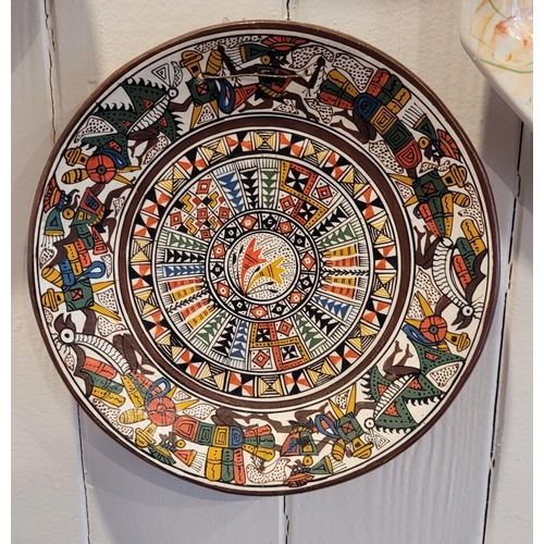 146 - A COLLECTION OF DECORATIVE WALL PLATES FROM AROUND THE WORLD; includes pieces from Peru, Portugal, C... 