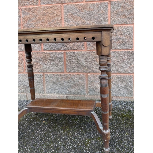 147 - A VINTAGE MAHOGANY OCCASSIONAL TABLE, pierced detail atop turned legs supported by undertier. Dimens... 