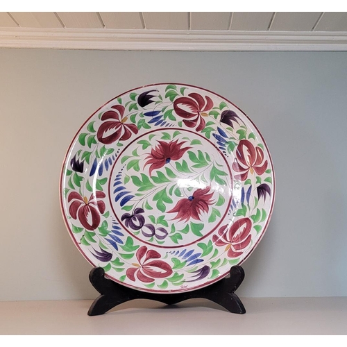 149 - A LARGE MANX & CO STONEWARE PLATTER / DISH, decorated all over with bright floral & foliage design, ... 