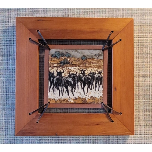 151 - J LOURIE, STAMPEDING WILDEBEEST, tile art/glazed tile, incised name lower right, 37cm x 37cm frame, ... 