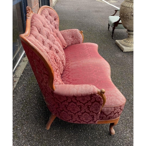 152 - A VINTAGE ROCOCO STYLE SETTEE, with curved shape, stained frame, finely upholstered with button back... 