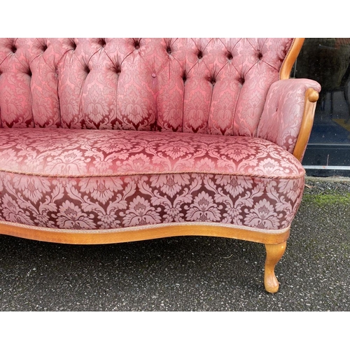 152 - A VINTAGE ROCOCO STYLE SETTEE, with curved shape, stained frame, finely upholstered with button back... 