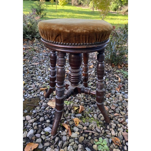 156 - A 19TH CENTURY MAHOGANY PIANO STOOL, with upholstered seat, standing on turned legs, with stretchers... 