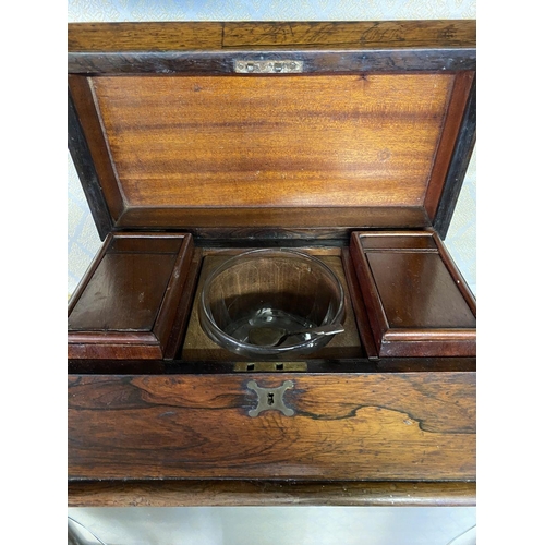 158 - AN ANTIQUE ROSEWOOD TEA CADDY, sarcophagus form, with scroll handles, standing on flattened bun feet... 