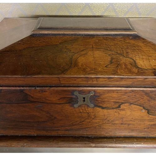 158 - AN ANTIQUE ROSEWOOD TEA CADDY, sarcophagus form, with scroll handles, standing on flattened bun feet... 