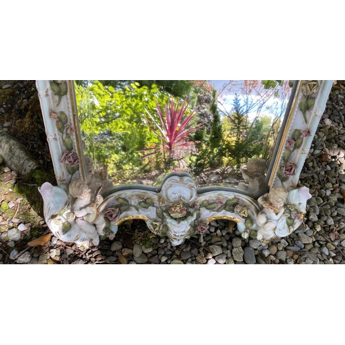 16 - A PAIR OF EXCELLENT 19TH CENTURY PORCELAIN CHERUB GIRANDOLE MIRRORS, of cartouche form, with bevelle... 