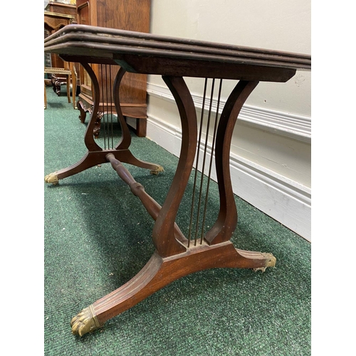 163 - AN ANTIQUE MAHOGANY COFFEE TABLE, with harp leg design supported by turned stretcher, fluted legs wi... 