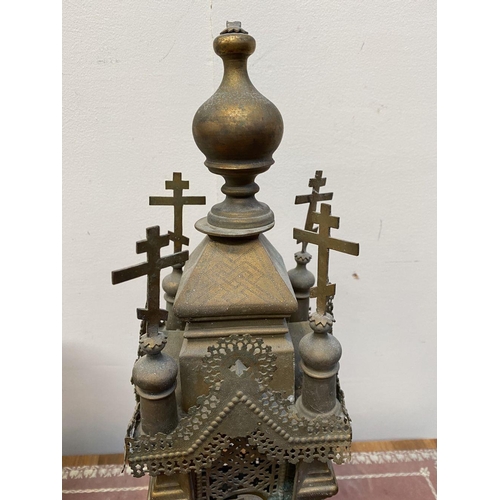 169 - AN ANTIQUE BRASS TABERNACLE, with four crosses to top, featuring open fretwork design, standing on p... 