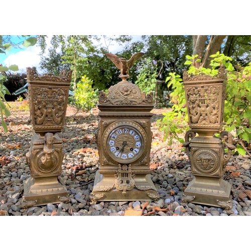 17 - AN ANTIQUE FRENCH ORMOLU MANTLE CLOCK AND PAIR OF URNS, solid bronze, all finely decorated with embo... 