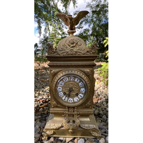 17 - AN ANTIQUE FRENCH ORMOLU MANTLE CLOCK AND PAIR OF URNS, solid bronze, all finely decorated with embo... 