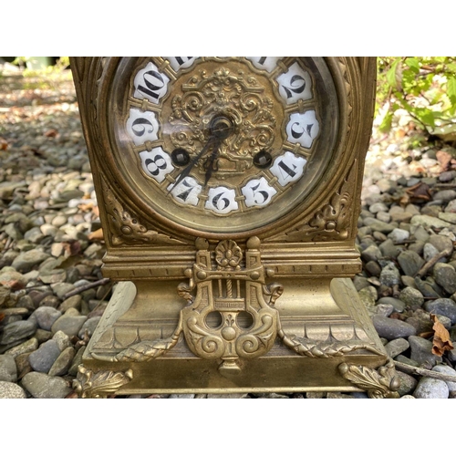 17 - AN ANTIQUE FRENCH ORMOLU MANTLE CLOCK AND PAIR OF URNS, solid bronze, all finely decorated with embo... 