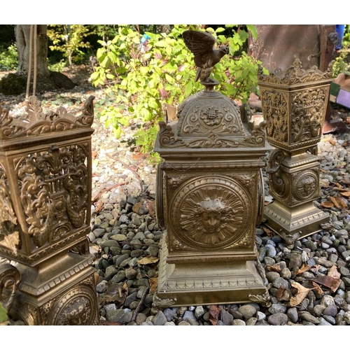 17 - AN ANTIQUE FRENCH ORMOLU MANTLE CLOCK AND PAIR OF URNS, solid bronze, all finely decorated with embo... 