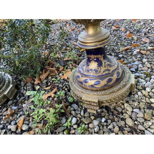 18 - A PAIR OF LARGE FRENCH SERVES PORCELAIN COVERED VASES, with ornate decoration including painted pane... 