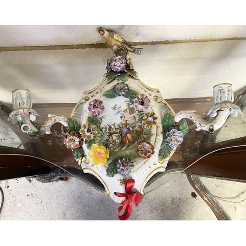 182 - A PAIR OF DECORATIVE PORCELAIN WALL SCONCES, cartouche form, with two candle arms. Decorated with pa... 