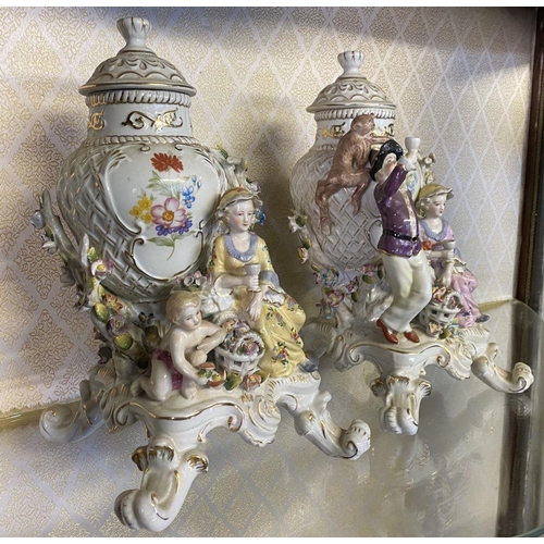 183 - A PAIR OF MEISSEN PORCELAIN FIGURAL COVERED VASES, finely decorated with painted floral details with... 