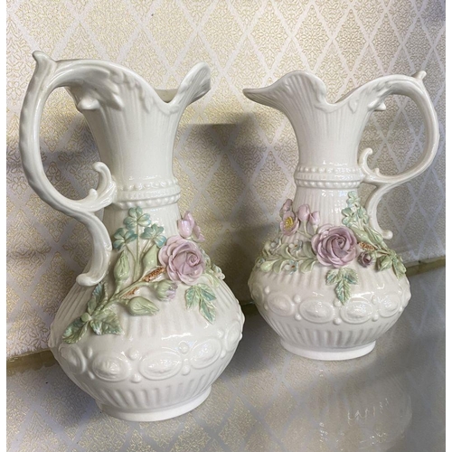 189 - A PAIR OF BELLEEK ABERDEEN PITCHER VASES, with painted pink rose and foliage design, scroll handle, ... 