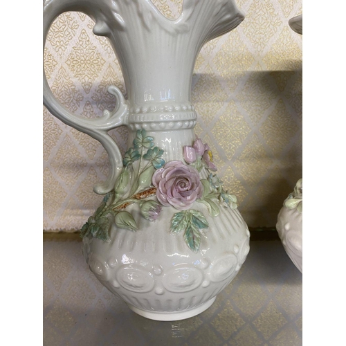 189 - A PAIR OF BELLEEK ABERDEEN PITCHER VASES, with painted pink rose and foliage design, scroll handle, ... 