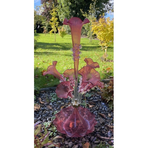 19 - AN EXCELLENT VICTORIAN RUBY GLASS EPERGNE, with ruffled base supporting six horns and surrounding a ... 