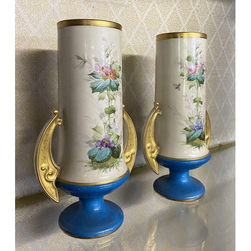 192 - A PAIR OF SERVES STYLE PORCELAIN VASES, cylindrical form with painted floral decoration, gilt rim an... 