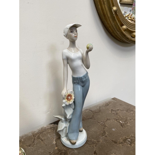 194 - A ROYAL DUX CERAMIC FIGURINE, ‘Woman in Winter’ c.1960, marked to base, along with a pair of vintage... 