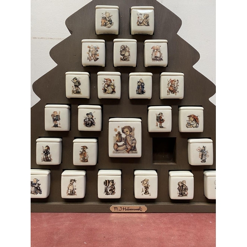 197 - AN ORIGINAL M.J. HUMMEL ADVENT CALENDAR, Mayfair edition, with 24 porcelain painted pieces, marked t... 