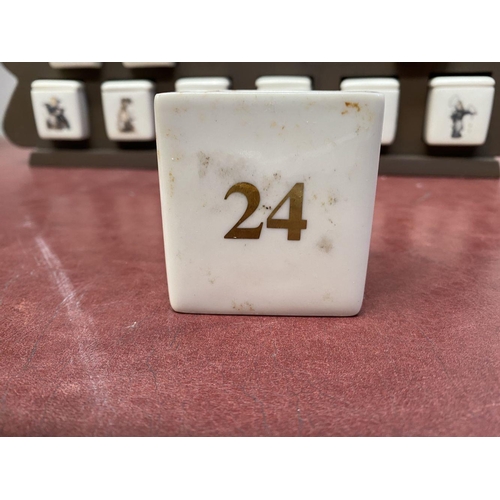 197 - AN ORIGINAL M.J. HUMMEL ADVENT CALENDAR, Mayfair edition, with 24 porcelain painted pieces, marked t... 