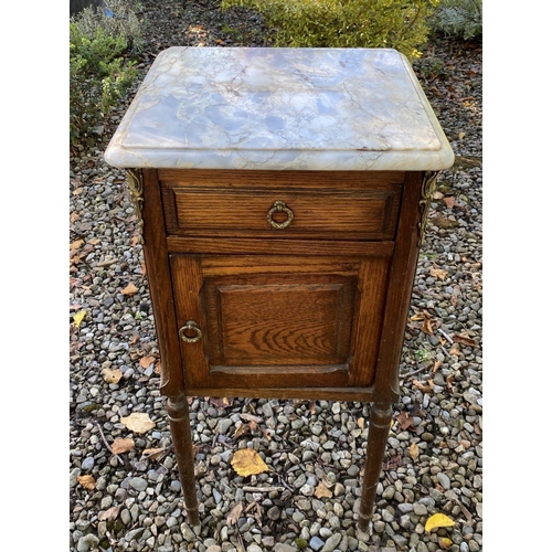 20 - A PAIR OF 19TH CENTURY MARBLE TOPPED BEDSIDE LOCKERS, with one drawer above panelled door, with bras... 