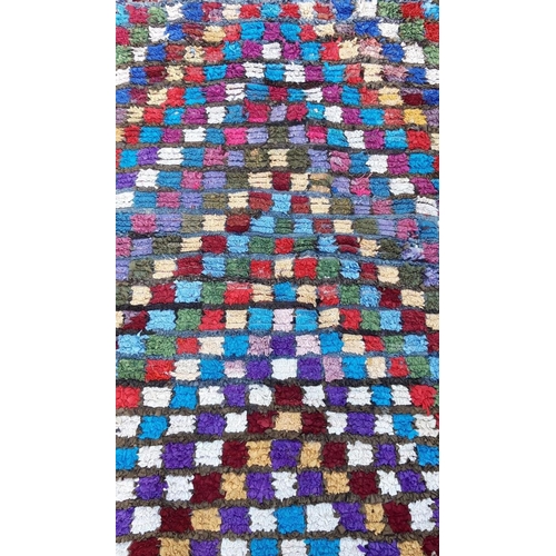 201 - A LARGE MORROCAN BERBER ‘BOUCHEROITE’ RUG, hand-knotted with vibrant colours in triangular geometric... 