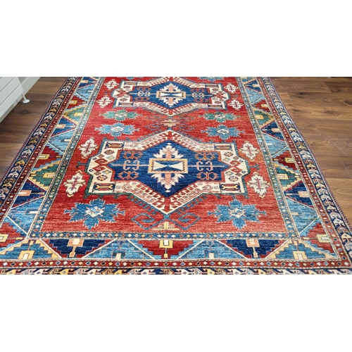 227 - A VERY GOOD QUALITY PERSIAN FLOOR RUG, handwoven, with a pair of central medallions surrounded by fl... 