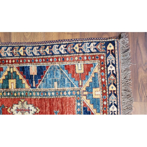 227 - A VERY GOOD QUALITY PERSIAN FLOOR RUG, handwoven, with a pair of central medallions surrounded by fl... 