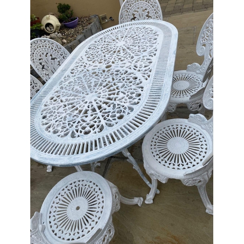 230 - A FINE WHITE CAST ALLOY GARDEN SET, to include an oval garden table with foliage decoration to under... 