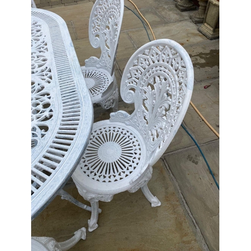 230 - A FINE WHITE CAST ALLOY GARDEN SET, to include an oval garden table with foliage decoration to under... 