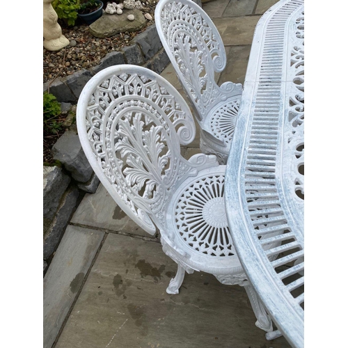 230 - A FINE WHITE CAST ALLOY GARDEN SET, to include an oval garden table with foliage decoration to under... 