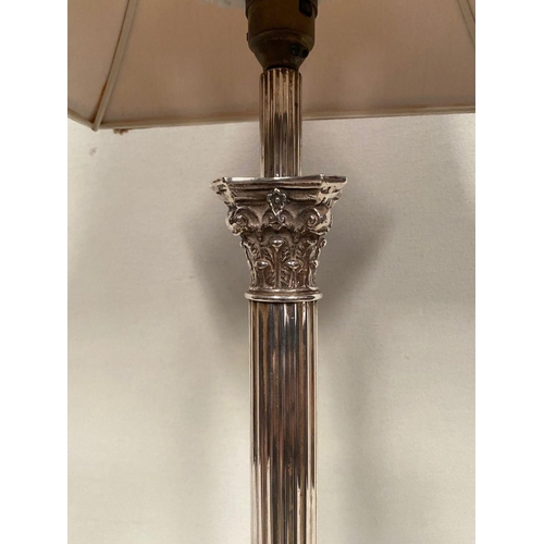 231 - A SILVER PLATED CORINTHIUM COLUMN TABLE LAMP, atop square platform marble topped base, on four lion ... 