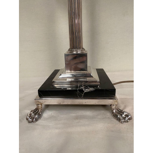 231 - A SILVER PLATED CORINTHIUM COLUMN TABLE LAMP, atop square platform marble topped base, on four lion ... 