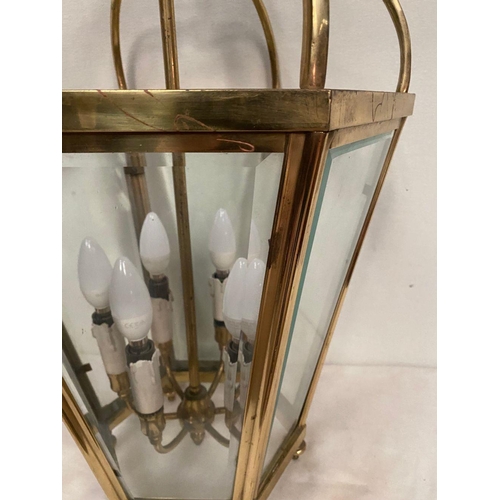 233 - A VINTAGE BRASS SIX SIDED LANTERN, c.1920, with bevelled glass, shaped body surrounding six branch c... 