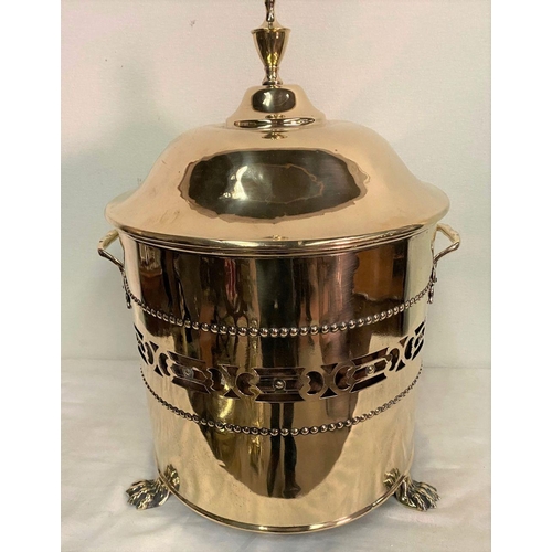 234 - A CIRCULAR BRASS COAL BUCKET, with original liner, finial to lid, pierced design to sides, two handl... 