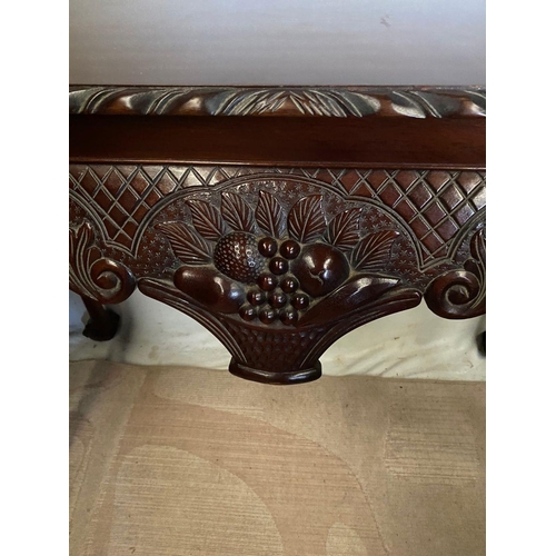 239 - AN IRISH STYLE MAHOGANY HALL TABLE, with gadrooned carving to edges above carved shaped frieze depic... 