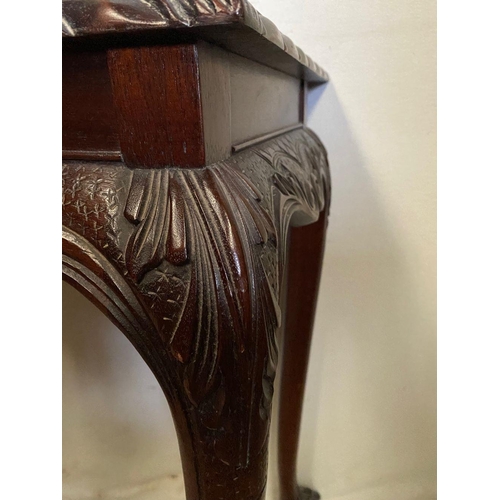 239 - AN IRISH STYLE MAHOGANY HALL TABLE, with gadrooned carving to edges above carved shaped frieze depic... 