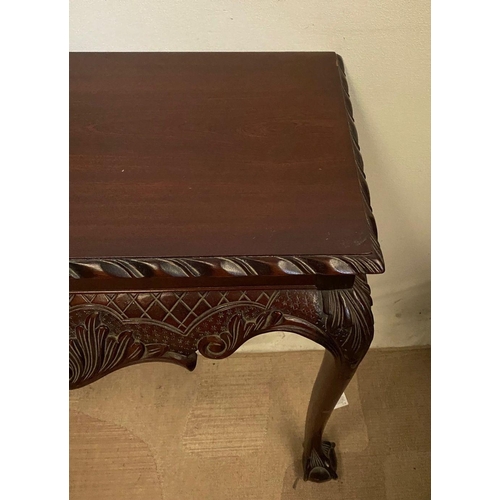 239 - AN IRISH STYLE MAHOGANY HALL TABLE, with gadrooned carving to edges above carved shaped frieze depic... 